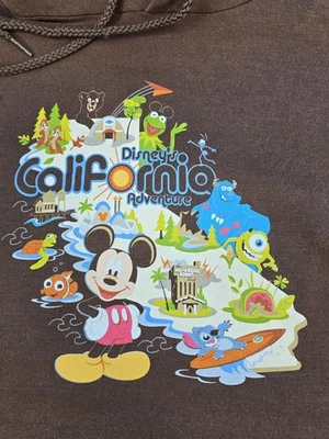 Sudadera con Capucha De Colección Disney California Adventure Adulto L Marrón Pullover Y2K Nemo Monsters Foto 1 de 4