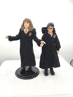 Figuras de acción Harry Potter y Hermione Granger muñecas túnicas plegables posables Foto 1 de 4