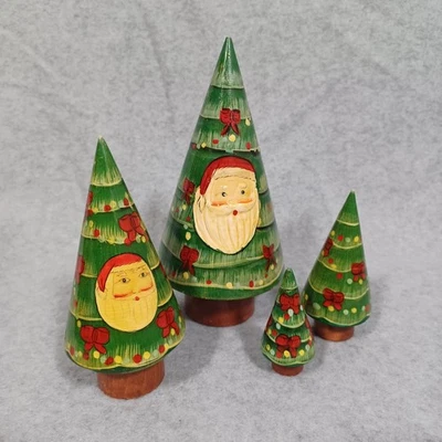 Vintage Wooden Christmas Tree Nesting Trees With Santa Face Set Of 4 - Image 1 of 4