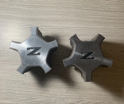 Juego de 2 tapacubos centrales para llantas de aleación Nissan 300ZX Z31 1984-1987 OEM Foto 1 de 3