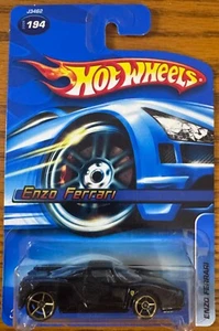 2006 Hot Wheels Mainline #194 Ferrari Enzo schwarz mit Gold OH5 & Logo + Protector - Bild 1 von 3