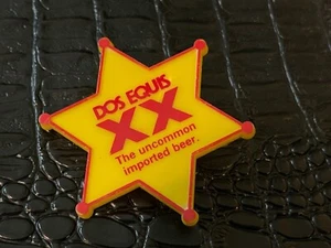PINBACK FIGURATIVO DE COLECCIÓN #D24 (NOSO) DOS ECUIS cerveza de importación - Imagen 1 de 1