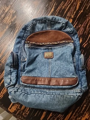 Mochila de mezclilla de colección Y2K descolorida Glory bolsa de libros con correas ajustables bronce azteca usada en excelente estado Foto 1 de 4