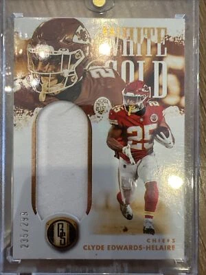 2022 Panini Gold Standard CLYDE EDWARDS-HELAIRE WHITE GOLD JERSEY /299 CHIEFS - Image 1 of 2