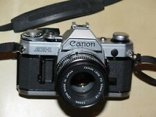 Canon AE-1 mit FD 1:1.8 50mm B&W Filter, Gummisonnenblende, Halsgurt