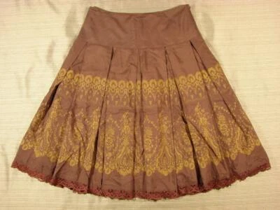 Falda Odille Plisada Seda/Algodón Estampado Adornado 2 Encajes Ribete Dorado Sobre Marrón Foto 1 de 4