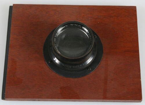 ANTIQUE LARGE FORMAT 5 X 7 BAUSCH LOMB TESSAR LENS ON 5 X 6.5 INCH BOARD.
