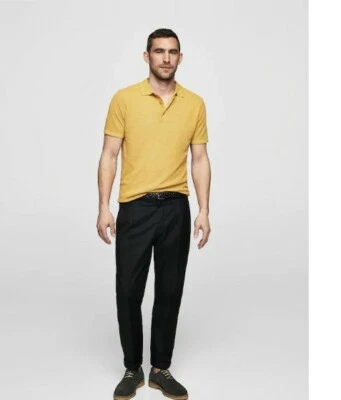 Pantalones plisados de algodón para hombre de Mango Foto 1 de 4