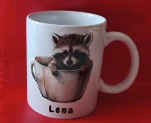 Neue Keramiktasse "Lena" mit Waschbär in der Tasse - Bild 1 von 1