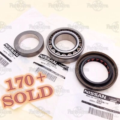 GENUINE Nissan Frontier Xterra Titan Rear Axle Bearing Inner Spacer Oil Seal SET Foto 1 de 4