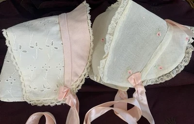 2 vintage baby bonnets 1 S & L organdy w pink embroidery. 1 eyelet w pink brim - Image 1 of 4