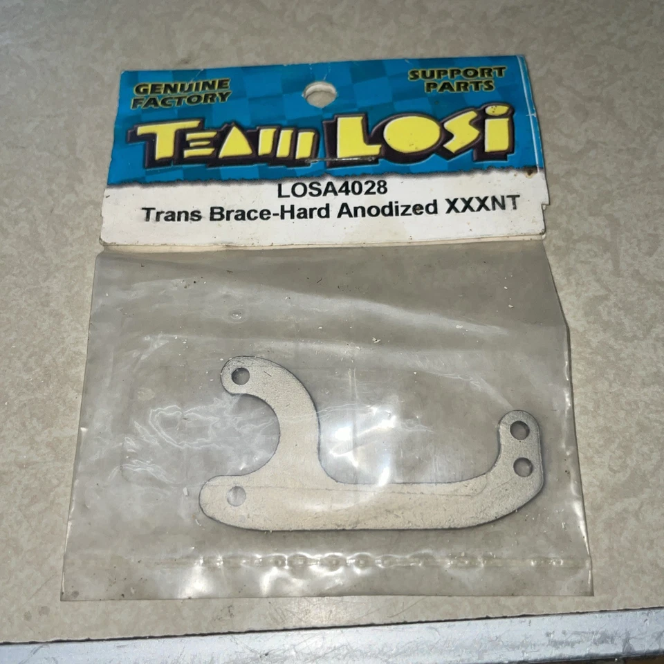 Team Losi  a-4028, LOSA4028 Drake XXX-NT Hard Anodized Trans Brace NIB - Image 1 of 1