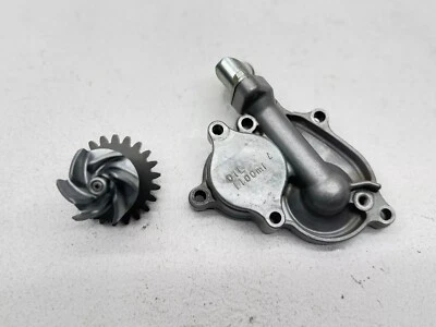 2015 Suzuki RMZ250 Water Pump Impeller Engine Housing Cover Shaft 17411-10H10 - Image 1 of 3