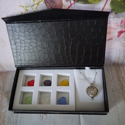 Silver Tone Heart Shaped Locket w/ 6 Interchangeable Center Hearts Stone Colors - Image 1 of 4