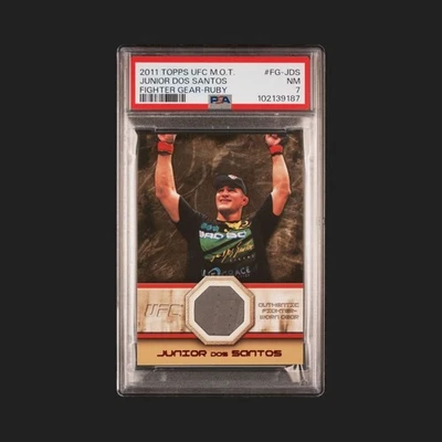 2011 Topps UFC M.O.T. Junior Dos Santos- Fighter Gear-Ruby Relic  #FG-JDS (MEM) - Image 1 of 2