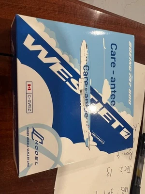 1:400 C Model WestJet Boeing 737-800 Care-antee C-GWSZ Diecast Model - Image 1 of 4
