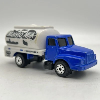 Camión cisterna utilitario Maisto 1:64 Maisto azul leche blanco suelto Foto 1 de 4
