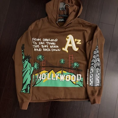 Sudadera con Capucha Hombre Mujer Cali to NYC en Algodón Marrón con Estampado Puff Mediana Foto 1 de 4