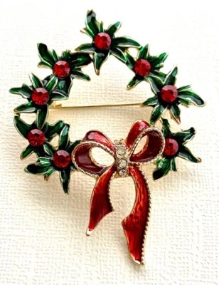 Colgante broche corona verde con pedrería roja y lazo rojo Foto 1 de 4