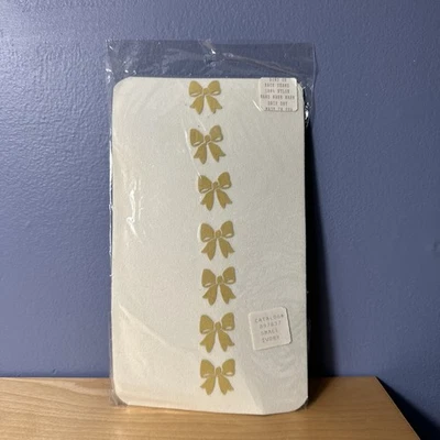 Medias marfil vintage con lazos dorados estampados en costura trasera pequeñas Foto 1 de 4