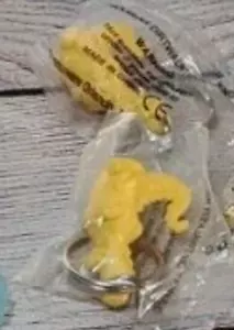 2 x Tupperware Yellow Dinosaur Fun Flyer Keychain Douglass Dirtwalker Dragon New - Picture 1 of 5