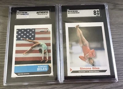 Tarjetas 2018 y 2014 Simone Biles graduadas Sports Illustrated para niños #777/#292 SI Foto 1 de 4