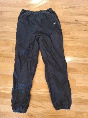 Antiga Calça Reebok Feminina Forrada Quebra-Vento Zíper no Tornozelo Nylon Baggy Preta M 8/10 - Imagem 1 de 4