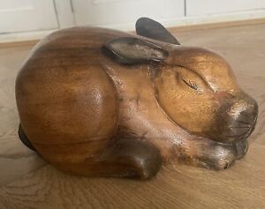 Large rabbit figurine carved from wood. 
