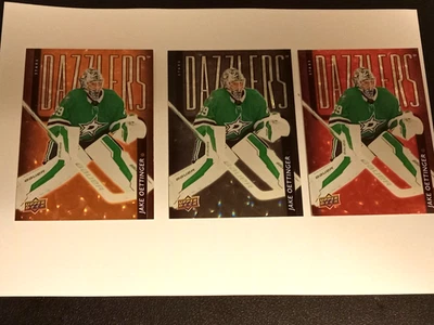 2025-26 Upper Deck Dazzlers Jake Oettinger DZ-22 (orange, red & SP black) Dallas - Image 1 of 2