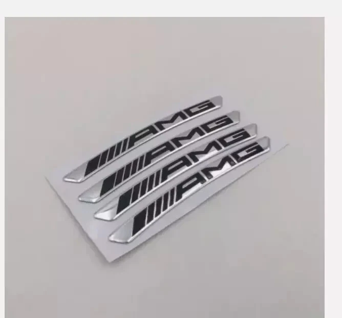 4 calcomanías de llanta AMG de metal de 9 cm plateadas con letras negras Foto 1 de 1