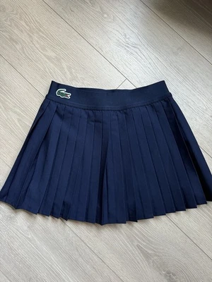 Pantalón Corto Deportivo LACOSTE Logo Tenis Plisado Azul Marino JF7784 Talla 36 NUEVO Foto 1 de 4