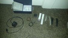 Silver Fitbit Versa Fitness tracker with 3 bands and 3 cases