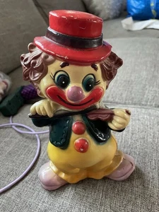 Vintage 60’s Happy Clown Playing Violin Plastic Coin Bank with plug Hong Kong - Bild 1 von 7