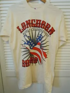 CAMISETA DE RODEO FRUIT OF THE LOOM CAMPEONATO MUNDIAL DE CUERNO LARGO TALLA M MARFIL SIN ETIQUETA - Imagen 1 de 4
