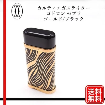 Encendedor de gas Cartier Goudron Zebra dorado negro usado Foto 1 de 4