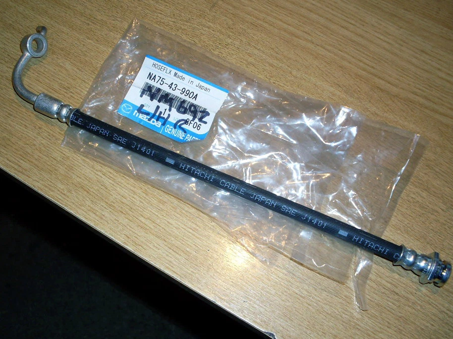 Тормозной шланг, задний l/h, подлинный Mazda MX-5, 89-05, Eunos MX5 n/s новый, левая рука - Изображение 1 из 1