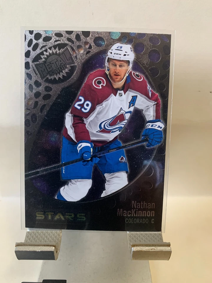 2022-23 Skybox Metal Universe Stars Nathan MacKinnon #141 Colorado Avalanches - Image 1 of 2