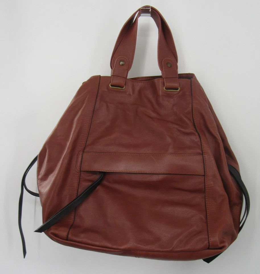 Bolso de hombro Gerard Darel de cuero marrón con detalle de cremallera con flecos negros Foto 1 de 4