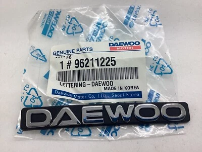 Nuevo Genuino Sellado Daewoo Cromo Negro Insignia Emblema Nexia Kalos Matiz Lacetti Foto 1 de 4