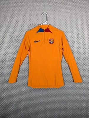 Nike F.C. Camiseta deportiva de fútbol Barcelona Advanced ADV para mujer pequeña naranja Foto 1 de 4