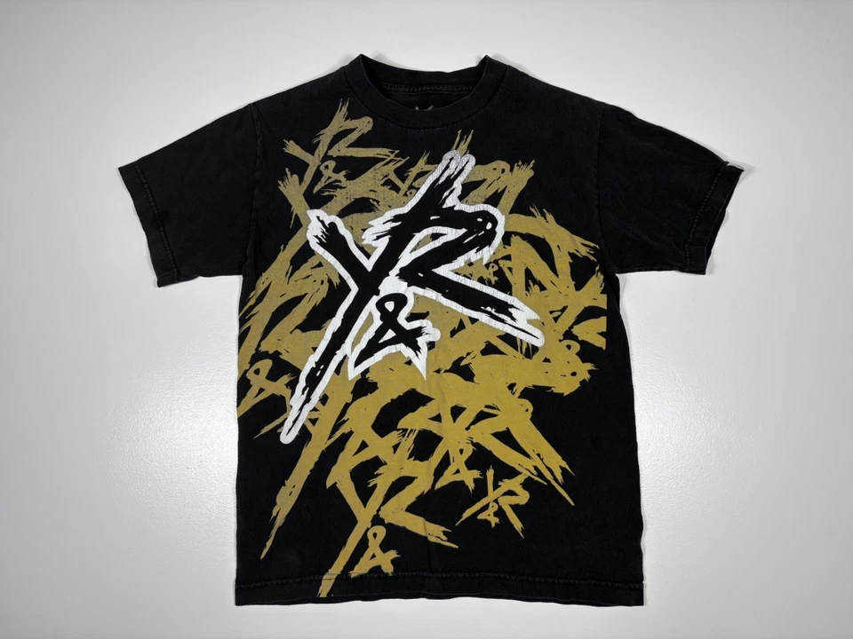 Camiseta joven imprudente adulto pequeña negra dorada gráfica ropa de calle skater camiseta Foto 1 de 4