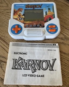 Karnov Tiger Electronics Handheld Game 1988 WORKING (missing battery cover) - Picture 1 of 4