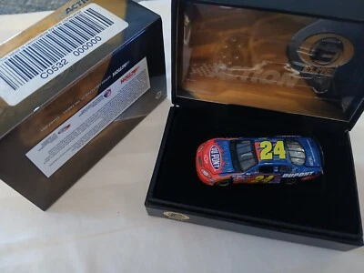 1:64 ACTION RCCA ELITE 2004 #24 DUPONT MONTE CARLO JEFF GORDON New  in Tin - Image 1 of 3