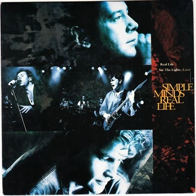 SIMPLE MINDS Real life 7" 45 rpm vinyl record BRAND NEW + juke box title strip - Image 1 of 3