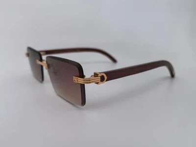 Gafas de sol Cartier con marco dorado de madera lentes marrones degradadas Foto 1 de 4