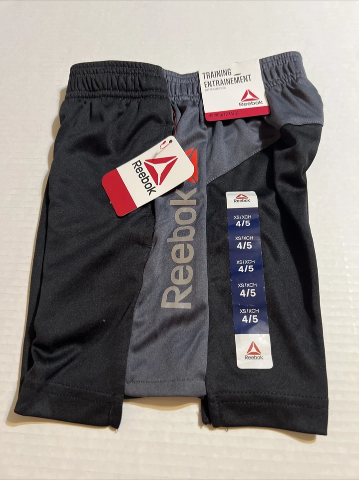 Pantalones cortos deportivos de baloncesto Reebok negros, grises y rojos para niños Foto 1 de 1