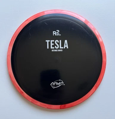 Disco de golf MVP Tesla 163g negro R2 neutrón plástico con llanta naranja disco Foto 1 de 2