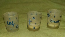 Lot of 3 Christmas frosted glass votive candle holder cups,
00004000
spells "Let It Snow"