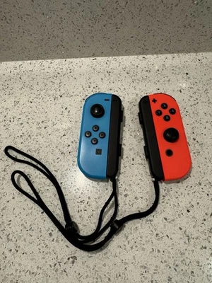 Nintendo Switch Joy-Cons Neon Red and Blue with Wrist Straps Official Genuine - Image 1 of 4