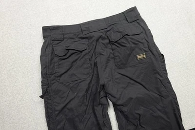 Pantalones cargo Duluth Trading para hombre 36x30 negros flexibles secos sobre la marcha forrados de lana trabajo Foto 1 de 4